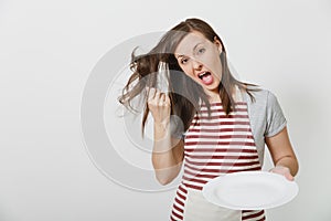 Portrait of young attractive smiling brunette caucasian housewife on white background. Beautiful housekeeper woman