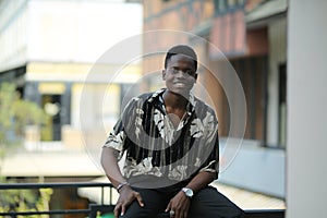 Portrait of young attractive stylish African American man model posing in casual clothes