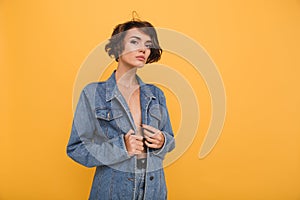 Portrait of a young attractive woman dressed in denim jacket