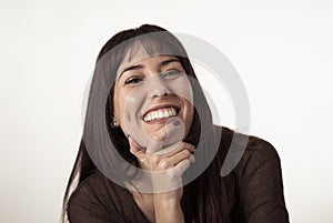 Portrait of young attractive woman with happy and smiling face. Human expressions and emotions