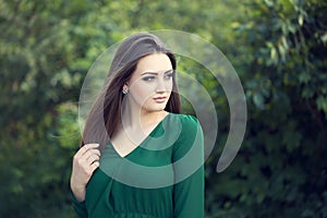 Portrait of an young attractive woman with long brown hair