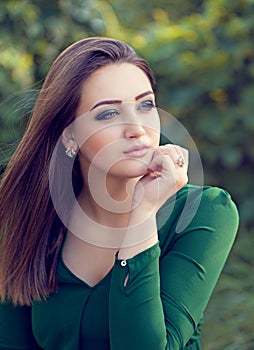 Portrait of an young attractive woman with long brown hair