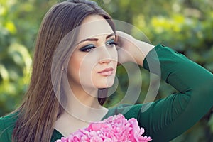 Portrait of an young attractive woman with long brown hair