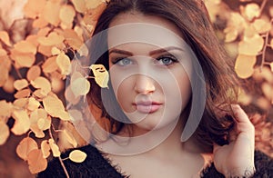 Portrait of an young attractive woman with long brown hair enjoy