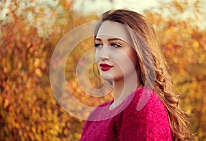 Portrait of an young attractive woman with long brown hair enjoy