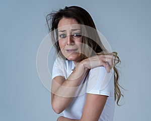 Portrait of a young attractive woman looking scared and shocked.Human expressions and emotions