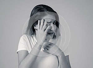 Portrait of a young attractive woman looking scared and shocked.Human expressions and emotions