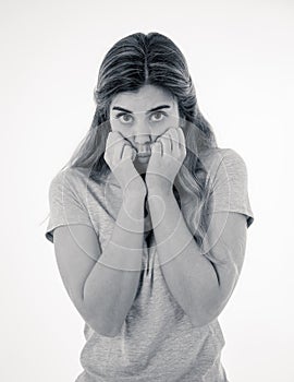 Portrait of young attractive woman looking scared and shocked. Human expressions and emotions