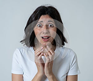 Portrait of a young attractive woman looking scared and shocked.Human expressions and emotions