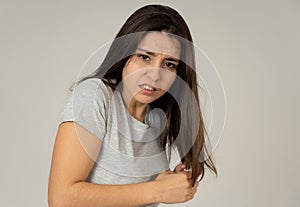 Portrait of a young attractive woman looking scared and shocked. Human expressions and emotions