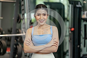 Portrait of young attractive woman smiling to camera at gym