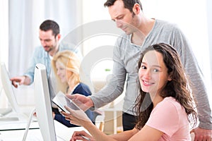 Portrait of a young attractive woman taking a training course