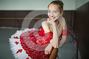 Portrait of a young ballerina with a beautiful smile. The model