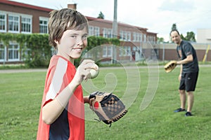 Portrait of a young baseball player in a field