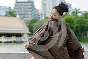 Portrait of young beautiful African woman at the park outdoors