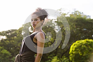 Portrait of young beautiful African woman at the park outdoors