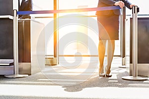 Portrait of young beautiful airport staff opening the gate for boarding in airport