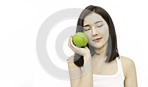 Portrait of young beautiful asian girl with hands holding green and red apple.