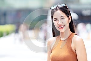Portrait of young beautiful asian woman, blogger, vlogger or stylish fashion smiling and looking at camera wearing off shoulder