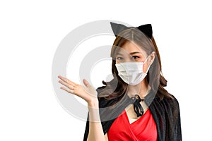 Portrait of young beautiful asian woman with protection face mask against coronavirus wearing red dress and black shawl on white