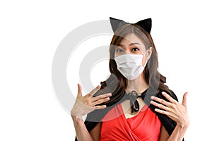 Portrait of young beautiful asian woman with protection face mask against coronavirus wearing red dress and black shawl on white