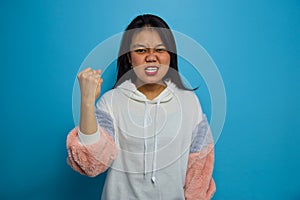 Portrait of Young beautiful asian women with blue  background