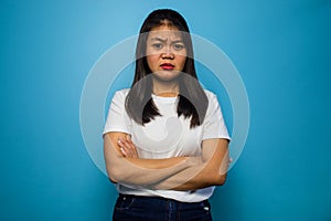 Portrait of Young beautiful asian women wearing white T-shirt with blue  background