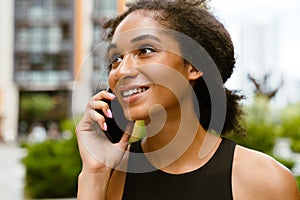 Portrait of young beautiful attractive smiling woman talking phone