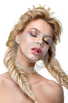 Portrait of young beautiful blonde woman with creative make-up