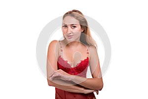 Portrait of young beautiful blonde woman in red underwear posing isolated over white background