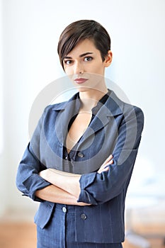 Portrait of young beautiful business woman in the office