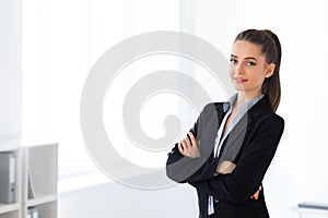 Portrait of young beautiful business woman in the office