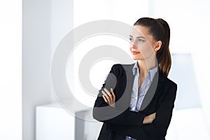 Portrait of young beautiful business woman in the office