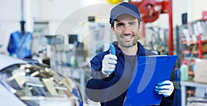 Portrait of a young beautiful car mechanic in a car workshop, in the background of a car service Concept repair of machines, fault