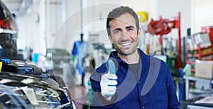 Portrait of a young beautiful car mechanic in a car workshop, in the background of a car service Concept repair of machines, fault