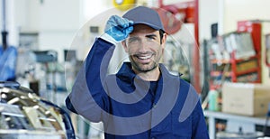 Portrait of a young beautiful car mechanic in a car workshop, in the background of service. Concept: repair of machines, fault dia