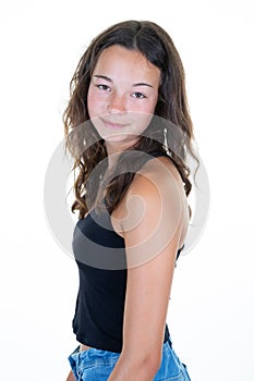 Portrait of young beautiful caucasian teenage girl in black t-shirt cheerfull smiling looking at camera in studio photo isolated