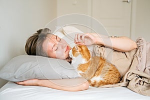 Portrait young beautiful caucasian woman wakes up in the morning. Woman hugging her cat at the morning. Lifestyle with home