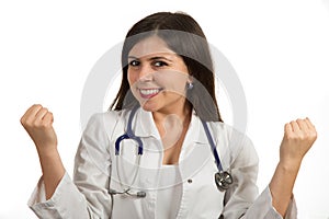 Portrait of young beautiful female doctor celebrating success