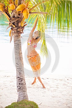 Portrait young beautiful girl relaxing on beach. Smiling woman spending chill time outdoor Bali island. Summer Season