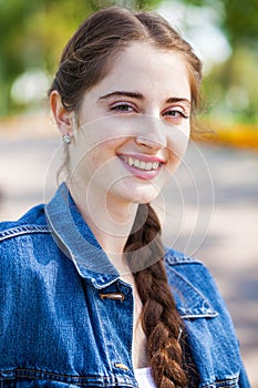 Portrait of a young beautiful girl, summer park outdoors