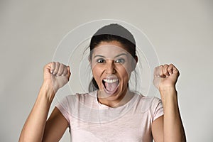 Portrait of young beautiful and happy Latin woman with big toothy smile excited and cheerful