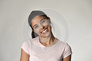 Portrait of young beautiful and happy Latin woman with big toothy smile excited and cheerful photo