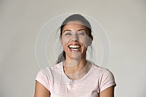 Portrait of young beautiful and happy Latin woman with big toothy smile excited and cheerful photo