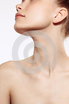 Portrait of young, beautiful and healthy girl with well-kept skin isolated on white background. The spa, surgery, face