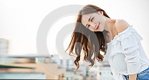 Portrait of young beautiful innocence asian woman in sky roof top.