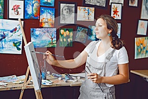 Caucasian woman artist drawing painting in art studio