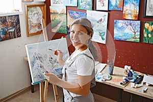 Caucasian woman artist drawing painting in art studio