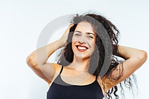 Portrait of young beautiful model with curly hair