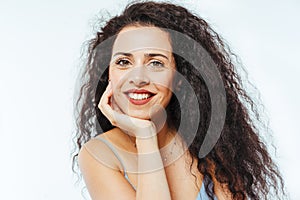 Portrait of young beautiful model with curly hair